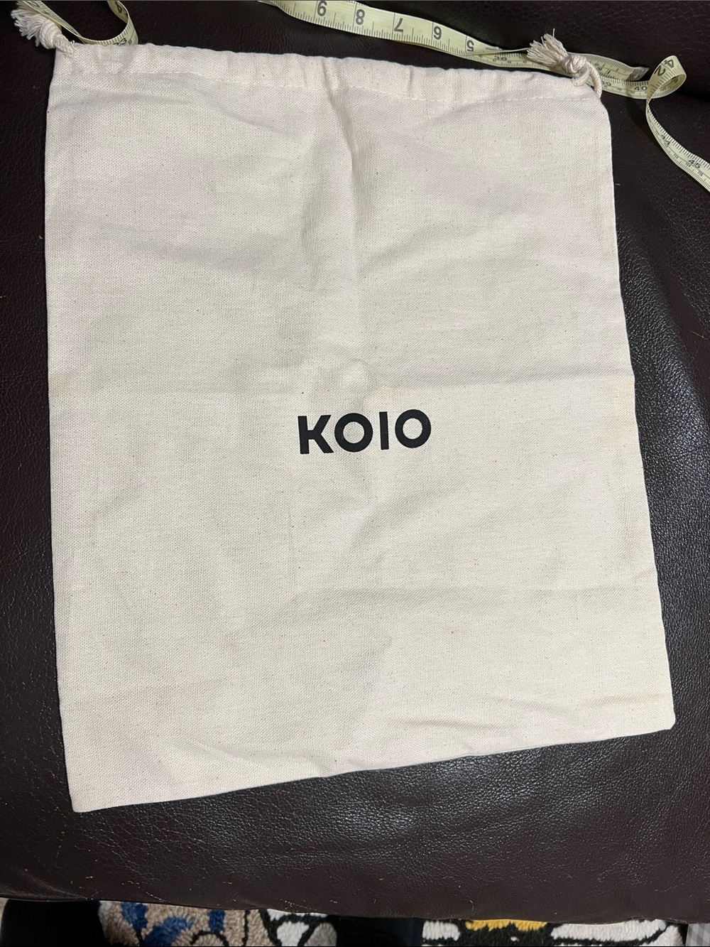 KOIO Natural Cotton Drawstring Bag with Black Logo